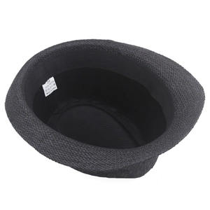 Detail view of the interior size 58 label and woven paper texture on a black fedora hat