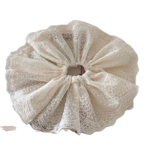 Double-layered white lace scrunchie with floral embroidery and scalloped edges