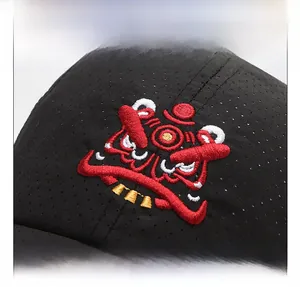 Detail of lion dance embroidery on black breathable mesh quick-dry baseball cap