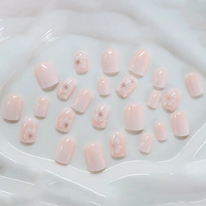 Pink gradient press-on nails with white cherry blossom flowers in short square shape