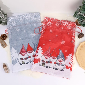Christmas burlap drawstring gift bags with festive gnome and snowflake patterns