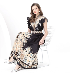Detail of vintage floral print maxi dress featuring ruffles and a matching waist belt