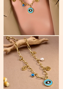 Detail of gold multi-pendant evil eye necklace with pearls and zircon on display