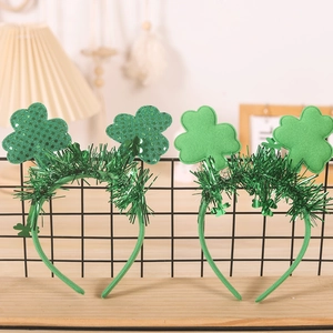 Detailed view of Saint Patrick's Day headbands with sequins and felt shamrock ornaments