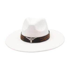 Detail of white western cowboy hat featuring a leather band with silver bull head ornament
