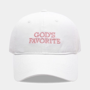Close-up of pink 'GOD'S FAVORITE' letter embroidery on a white cotton baseball cap