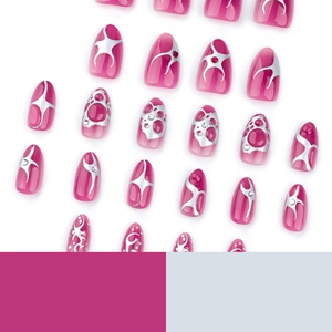 Pink Y2K press-on nails with silver metallic flame patterns and sparkling rhinestones