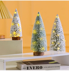 Mini flocked Christmas trees with warm LED lights and rustic wooden bases set of three