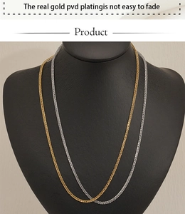 Detail of gold and silver stainless steel link chains with real gold PVD plating
