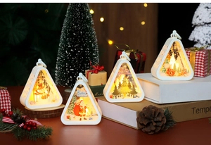 Detail of Christmas LED triangle lantern set with Santa and snowman patterns