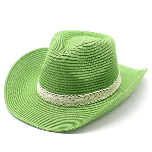 Detailed close-up of woven straw jazz hat in vibrant green with elegant white lace band