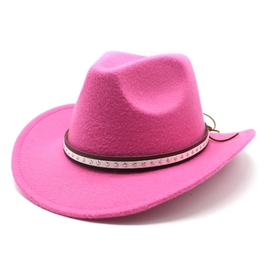 Detail of pink felt cowboy hat featuring leather band with silver star studs