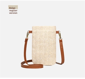 Detail view of beige straw woven texture and brown leather strap on a summer phone bag
