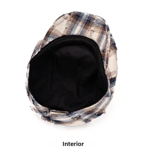 Détail de la doublure intérieure et de la texture du tissu de ce béret à carreaux