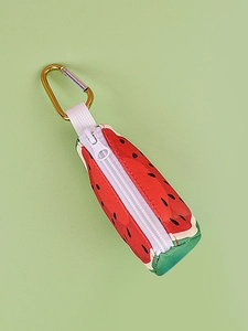 Detail view of watermelon-shaped pet waste bag dispenser with durable metal carabiner clip