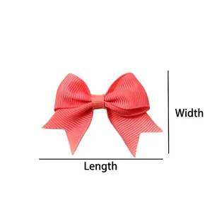 Solid peach swallowtail bow hair clip for girls, size 4x6 cm on a white background