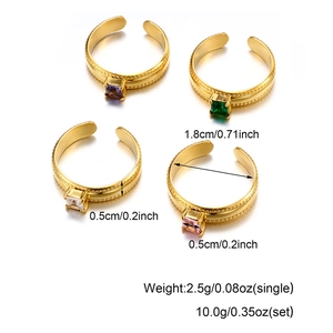Detailed view of four adjustable gold rings with vibrant square-cut zircon gemstones