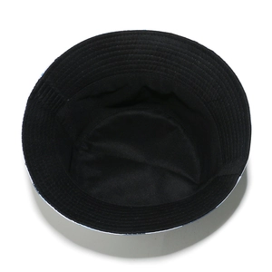 Detail view of the black bucket hat interior showing clean stitching and lining