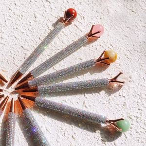 Sparkling crystal ballpoint pens with rose gold trim and assorted colorful gemstones