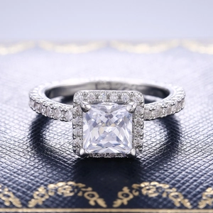 Elegant 925 sterling silver halo ring with a princess cut square diamond on jewelry box