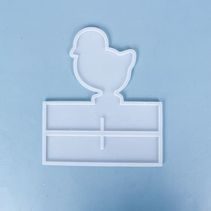 Detail of translucent silicone mold showing a cartoon chicken shape for DIY resin crafts