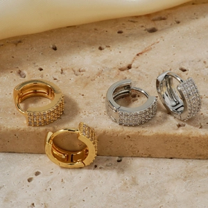 Sparkling micro-pave zircon hoop earrings set in polished gold and silver finishes