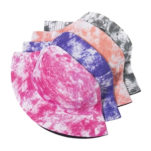 Close-up of tie-dye bucket hats in pink and purple colors with durable stitching detail