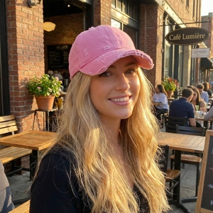 Pink distressed washed cotton baseball cap with vintage worn details for outdoor leisure