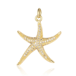 Detailed close-up of a gold starfish pendant with sparkling zircon inlays on white backdrop