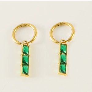 Detail of 18K gold stainless steel earrings featuring three green rectangular zircons