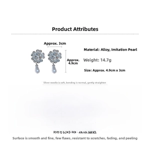 Detail view of flower earrings with pearls and crystals featuring 4.9cm x 3cm dimensions