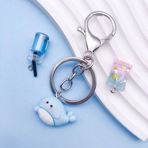 Cute blue whale keychain with matching soda cup and sweet candy charms on metal ring
