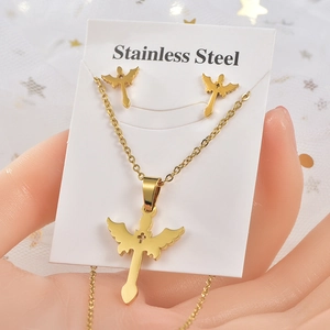 Golden stainless steel jewelry set featuring angel wing and cross necklace with earrings