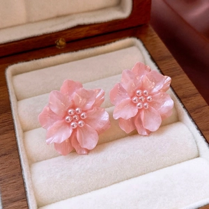 Pink acrylic flower stud earrings with faux pearls on premium velvet jewelry box
