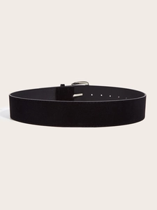 Detail of black suede wide belt with polished silver square buckle on white background