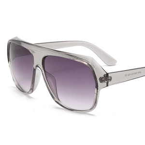 Fashionable oversized square sunglasses with grey transparent frame and purple gradient lenses