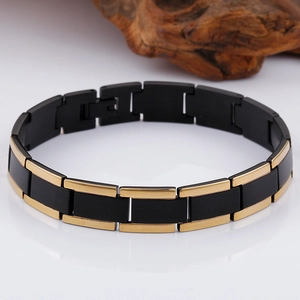 Close-up of gold and black two-tone titanium steel bracelet with matte and mirror finishes