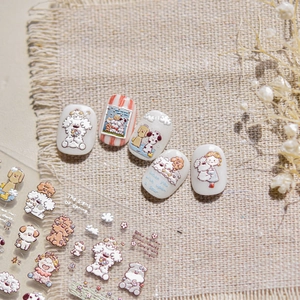 Macro view of 3D embossed dog nail stickers with cute cartoon characters on nails