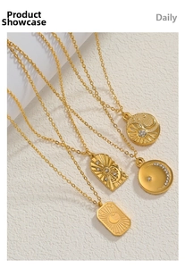 Detailed view of four 18K gold plated celestial pendants with sun moon and star motifs