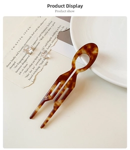 Detail of tortoise shell pattern U-shaped hair pin with a double-prong design