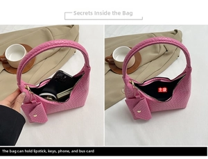 Detail view of pink woven handbag interior showing storage capacity for daily essentials