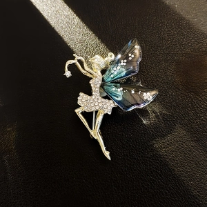 Elegant silver ballet dancer brooch with sparkling rhinestones and blue gradient wings