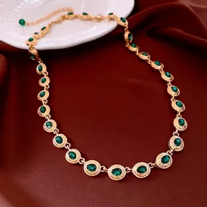 Vintage gold necklace with oval green gems on red silk, luxury adjustable jewelry