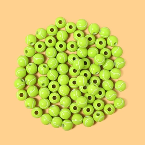 Macro shot of bright yellow-green acrylic tennis beads for DIY jewelry and necklaces
