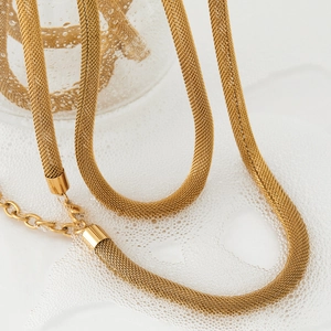 Luxurious gold plated woven mesh chain necklace shown in a fresh waterproof water scene