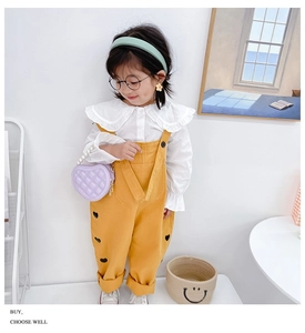 Girl's fashion look with yellow heart-embroidered overalls and purple quilted heart bag