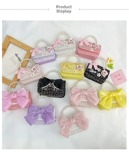 Overhead view of tweed mini bags with pearl handles and decorative silk bows