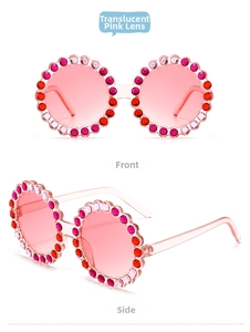 Detailed close-up of kids round sunglasses featuring pink lenses and colorful rhinestones