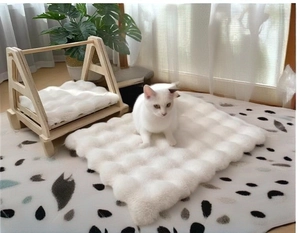 Cozy white plush cushion on A-frame solid wood pet bed for cats and small dogs