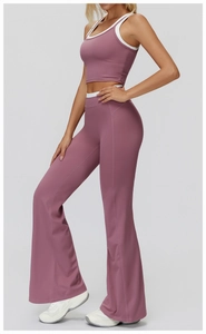 Side view of mauve ribbed yoga set showing layered crop top and high-waisted flared pants